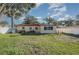 Spacious backyard with grassy area and patio at 716 Katherine St, South Daytona, FL 32119