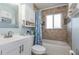 Clean bathroom with a bathtub, shower, and updated vanity at 716 Katherine St, South Daytona, FL 32119