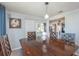 Dining area with a wood table and ocean-themed decor at 716 Katherine St, South Daytona, FL 32119