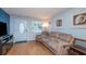 Living room with light blue walls and hardwood floors at 716 Katherine St, South Daytona, FL 32119