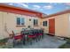 Outdoor patio with a table and chairs, perfect for dining al fresco at 716 Katherine St, South Daytona, FL 32119
