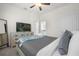 Spacious bedroom with a queen bed, dresser, and ensuite bathroom at 7260 Oakmoss Loop, Davenport, FL 33837