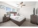 Spacious bedroom with a king-size bed and TV at 7260 Oakmoss Loop, Davenport, FL 33837