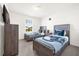 Two twin beds, dresser, and TV in a well-lit bedroom at 7260 Oakmoss Loop, Davenport, FL 33837
