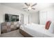 Bedroom with king-size bed, TV, and plenty of closet space at 7260 Oakmoss Loop, Davenport, FL 33837