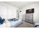 Spacious bedroom with two twin beds and a dresser at 7260 Oakmoss Loop, Davenport, FL 33837