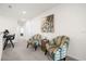 Upstairs hallway with seating area and built-in workspace at 7260 Oakmoss Loop, Davenport, FL 33837