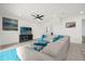 Living room with sectional sofa and access to backyard at 7260 Oakmoss Loop, Davenport, FL 33837