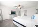 King-size bed, dresser, and ensuite bathroom access at 7260 Oakmoss Loop, Davenport, FL 33837