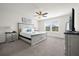 Main bedroom with king-size bed, ceiling fan and dresser at 7260 Oakmoss Loop, Davenport, FL 33837