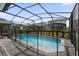 Inviting screened pool with paver deck at 7260 Oakmoss Loop, Davenport, FL 33837