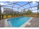 Inviting screened pool with paver deck at 7260 Oakmoss Loop, Davenport, FL 33837