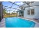 Inviting screened pool with paver deck at 7260 Oakmoss Loop, Davenport, FL 33837