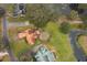 Aerial view of a single Gathering home on a large lot next to a lake at 808 N Shore Dr, Leesburg, FL 34748