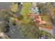 Aerial view showing a single-Gathering home on a large lot near a canal at 808 N Shore Dr, Leesburg, FL 34748