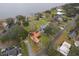 Aerial view of a house near the lake with a large lot and surrounding houses at 808 N Shore Dr, Leesburg, FL 34748