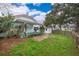 Backyard with patio and grassy area at 808 N Shore Dr, Leesburg, FL 34748