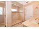 Large walk-in shower with tiled walls and window at 808 N Shore Dr, Leesburg, FL 34748