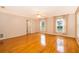 Spacious bedroom with hardwood floors and large windows at 808 N Shore Dr, Leesburg, FL 34748