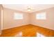 Spacious bedroom with hardwood floors and window shutters at 808 N Shore Dr, Leesburg, FL 34748