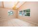 Bright dining room with large windows and chandelier at 808 N Shore Dr, Leesburg, FL 34748