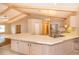 Kitchen with light cabinets, large island and stainless steel appliances at 808 N Shore Dr, Leesburg, FL 34748