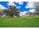 Lakefront property with lush green lawn at 808 N Shore Dr, Leesburg, FL 34748