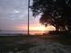 Peaceful sunset view over the lake at 808 N Shore Dr, Leesburg, FL 34748