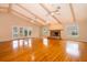 Open living space with hardwood floors, fireplace and access to patio at 808 N Shore Dr, Leesburg, FL 34748