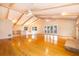 Spacious living area with hardwood floors, high ceilings, and a fireplace at 808 N Shore Dr, Leesburg, FL 34748