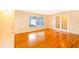 Bright living room featuring hardwood floors and French doors at 808 N Shore Dr, Leesburg, FL 34748