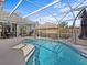 Screened-in pool area with hot tub at 843 Hammocks Dr, Ocoee, FL 34761