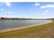 Community lake view with fountain and shoreline at 8468 Powder Ridge Trl, Windermere, FL 34786