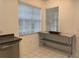Kitchen area featuring stainless appliances, neutral countertops, and natural light at 8634 Danforth Dr, Windermere, FL 34786