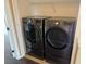 Laundry area featuring modern, front-load washer and dryer units at 8634 Danforth Dr, Windermere, FL 34786