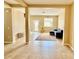 Open living area with neutral color palette, tile flooring, and access to outdoor space at 8634 Danforth Dr, Windermere, FL 34786
