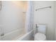 Simple bathroom with a toilet and shower/tub at 8794 Eden Cove Dr, Winter Garden, FL 34787