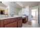 Double vanity bathroom with a large mirror and tile flooring at 8794 Eden Cove Dr, Winter Garden, FL 34787