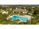 Community pool with lounge chairs and landscaping at 8794 Eden Cove Dr, Winter Garden, FL 34787