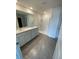 Bright bathroom features double sinks, white cabinets, and walk in shower at 8864 Sw 49Th Cir, Ocala, FL 34476