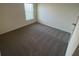 Bedroom featuring neutral carpet, neutral walls and a window at 8864 Sw 49Th Cir, Ocala, FL 34476