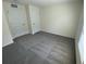 This is a bedroom with neutral walls, plush grey carpeting and ample natural light at 8864 Sw 49Th Cir, Ocala, FL 34476