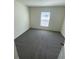 Bedroom featuring neutral carpet, neutral walls and a window at 8864 Sw 49Th Cir, Ocala, FL 34476