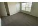 Bedroom featuring neutral carpet, neutral walls and a window at 8864 Sw 49Th Cir, Ocala, FL 34476