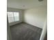 Bedroom featuring neutral carpet, neutral walls and a window at 8864 Sw 49Th Cir, Ocala, FL 34476