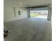 An empty two car garage with the garage door open showing a view of the street at 8864 Sw 49Th Cir, Ocala, FL 34476
