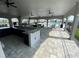 Outdoor kitchen features sleek cabinetry, granite countertops, and modern appliances at 8864 Sw 49Th Cir, Ocala, FL 34476