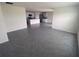 Bright living room with gray tile flooring and view into the kitchen at 8864 Sw 49Th Cir, Ocala, FL 34476