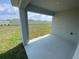 Back patio has a view of the yard and the top of the fence line in the distance at 8864 Sw 49Th Cir, Ocala, FL 34476