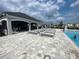 Community pool featuring sun loungers and ample seating for relaxation in the sun at 8864 Sw 49Th Cir, Ocala, FL 34476